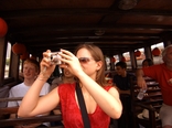 [Taking photographs on the riverboat]