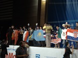 [Nathan on stage, rather obscured by a Kazakh flag]